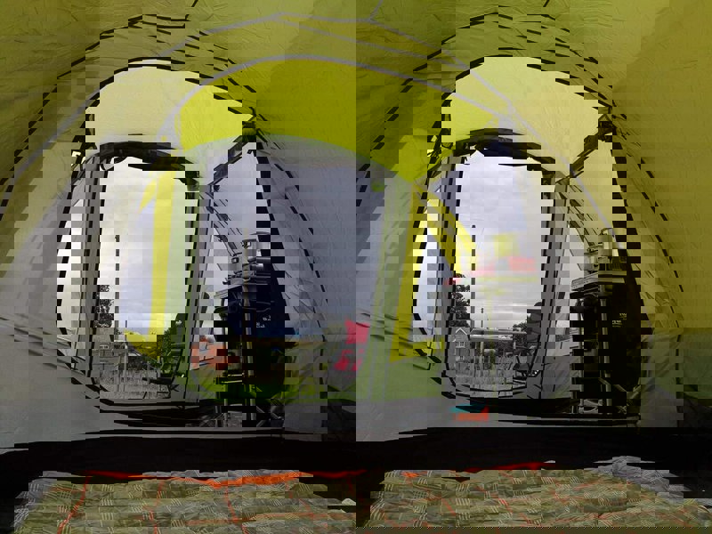 The inside bedroom pod of the Abberley XL 4 Berth Tent by OLPRO with a sleeping bag inside of it.