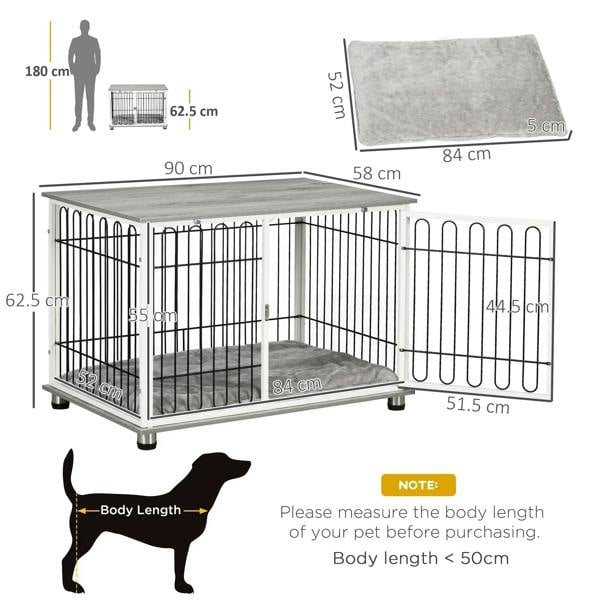 Grey cushioned indoor dog crate end table with open doors, black bar fence