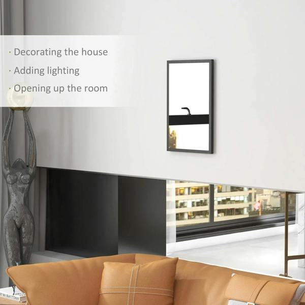 Black framed wall mirror reflecting room lights and seating