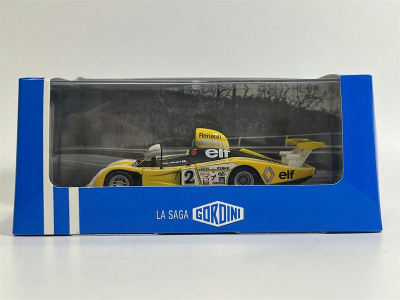 a yellow race car in a box