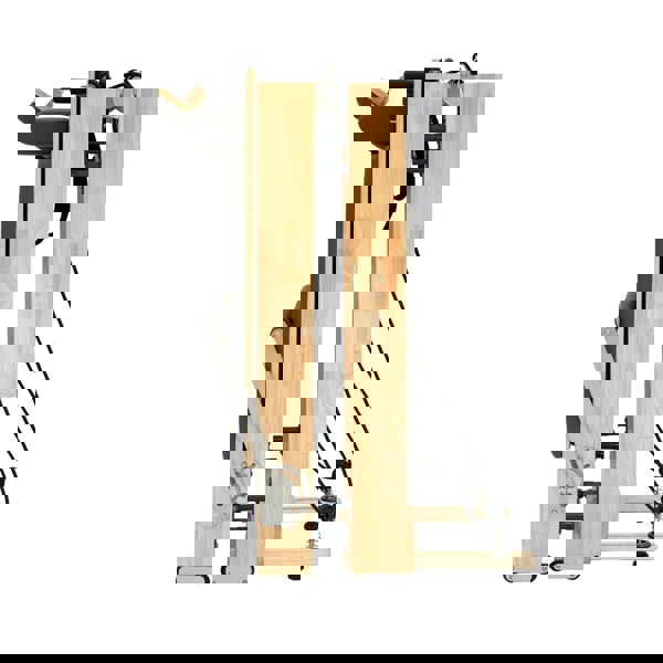 Pilates reformer machine in oak wood, featuring a sleek, compact design with adjustable resistance cords and padded platform