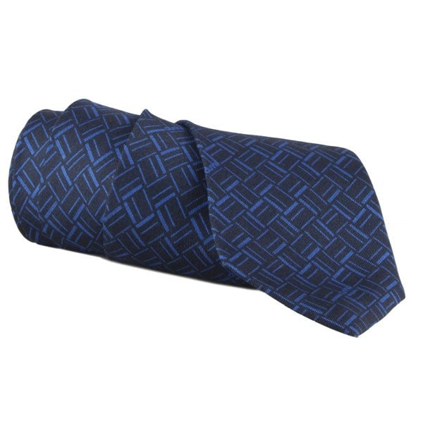 Dunhill silk tie featuring an abstract longtail print inspired by the exaggerated typography of the iconic dunhill logo navy blue