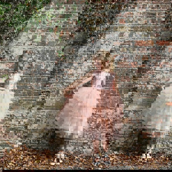 Pretty girl holding dress