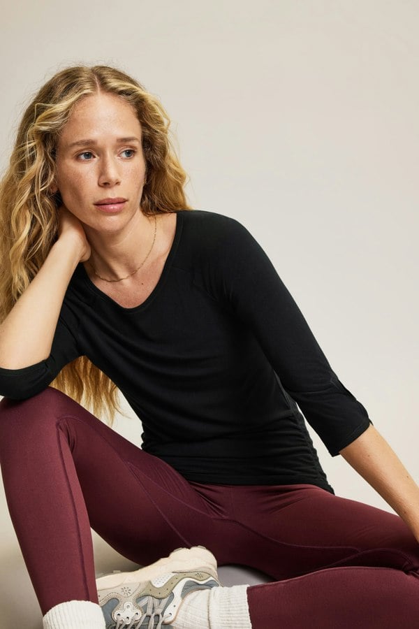 Black soft bamboo 3/4 sleeve performance round neck top with side ruching for yoga, pilates, running and exercise.