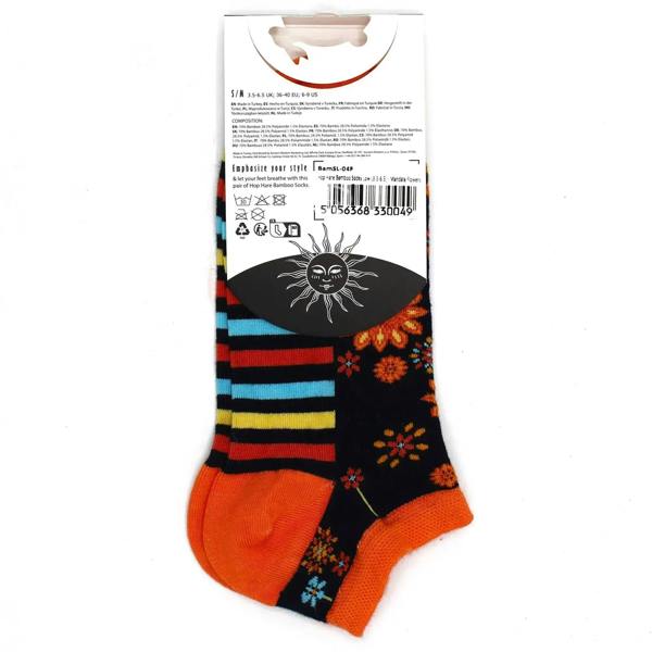 Bamboo low-cut socks on backing card, black with orange toe, rainbow stripes and floral print