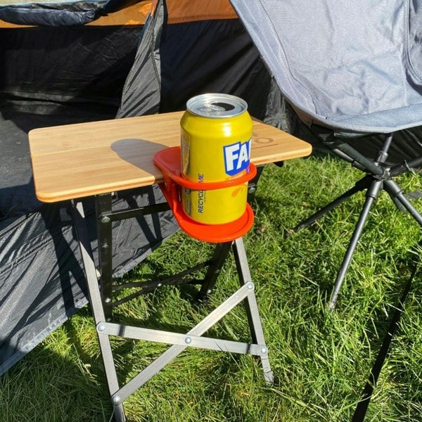 Orange Drink Holder Table Clip OLPRO - with can on table edge in field next to awning