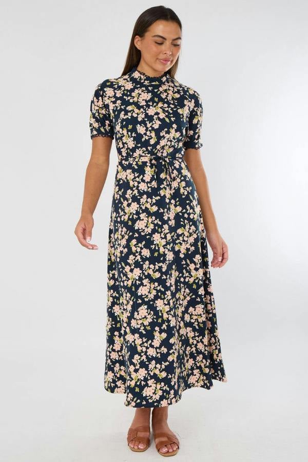 Woman wearing a floral dress on a white background