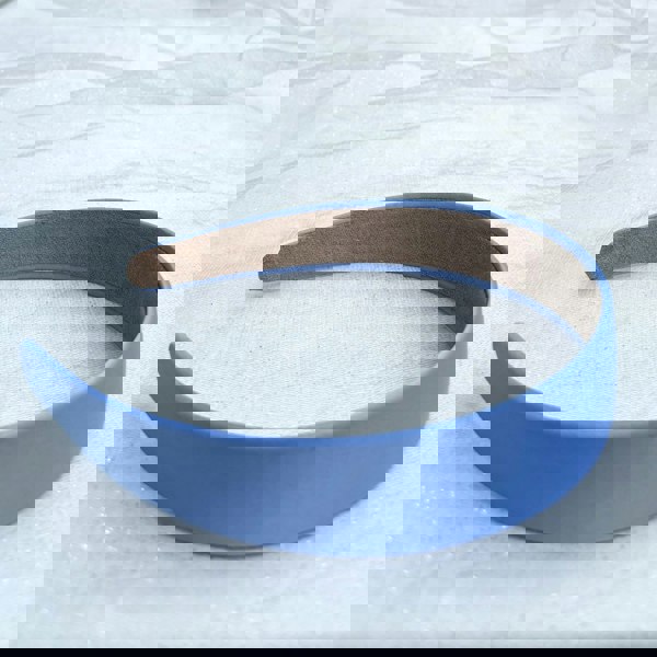 Blue hairband, smooth satin finish, soft matte texture, structured shape, classic everyday accessory, minimalist design

