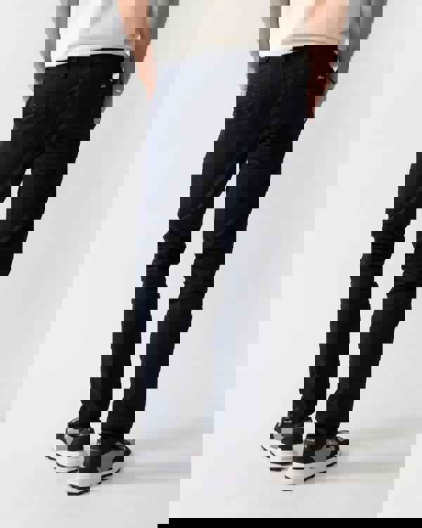 back shot of a model wearing Lacoste Slim Fit Stretch Cotton Mens Chinos in Abysm HDE