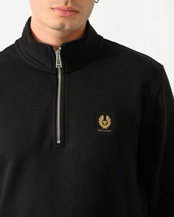 close up shot of a model wearing a Belstaff Mens Logo Quarter Zip Sweatshirt in Black