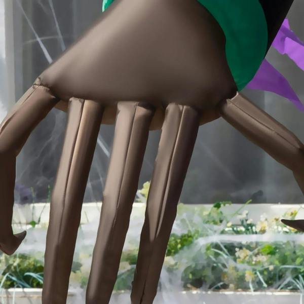 Inflatable vampire costume legs with ribbed brown fabric and black robe hem