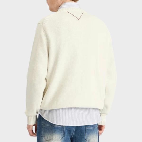 Back view of Supplied Fashion white crewneck knit sweater with subtle red V-stitch detail on the collar