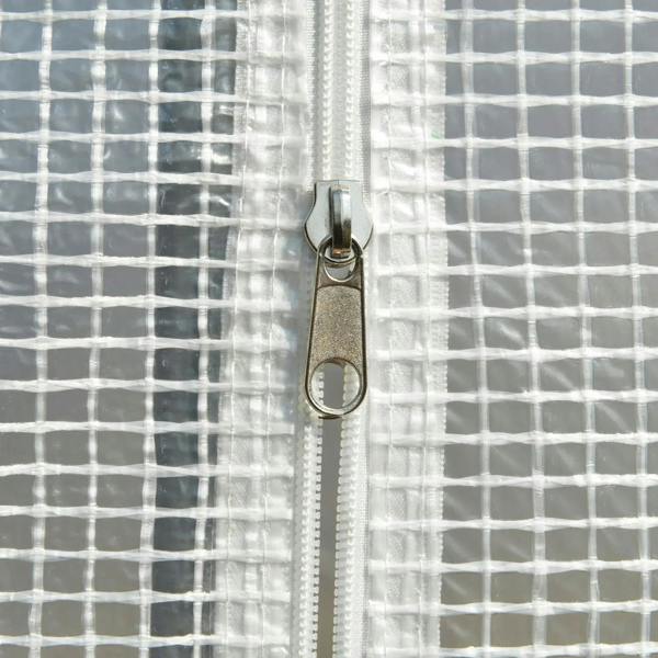White zipper track and metal pull on greenhouse cover seam
