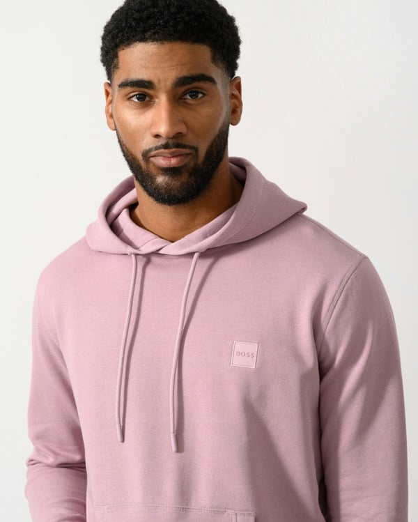 Detail shot of a Model wearing a BOSS Orange Wetalk Mens Pullover Hoodie With Logo Patch in Light/Pastel Purple