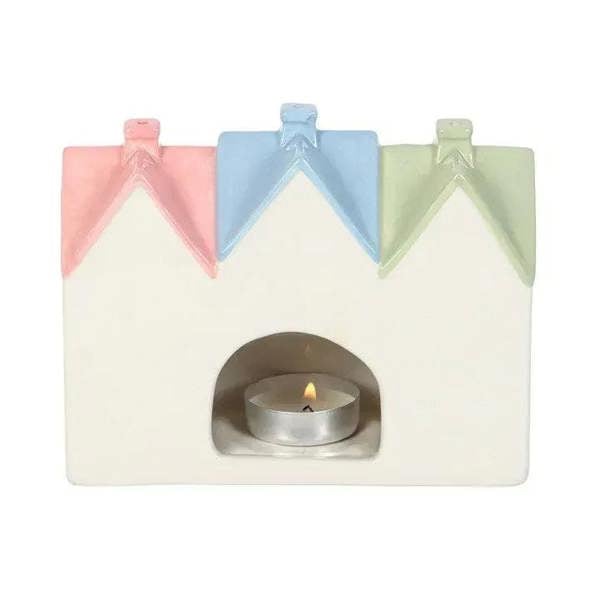 House incense burner and tealight holder, front view with tealight flame inside arch cutout