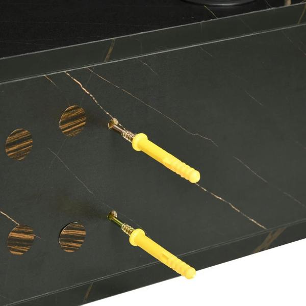 Black marble-veined tabletop close-up with gold accents and fasteners