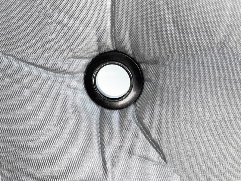 Close up image of the large eyelet on the Internal Blackout Insulated Blind Set for VW T5/T6 Campervans OLPRO