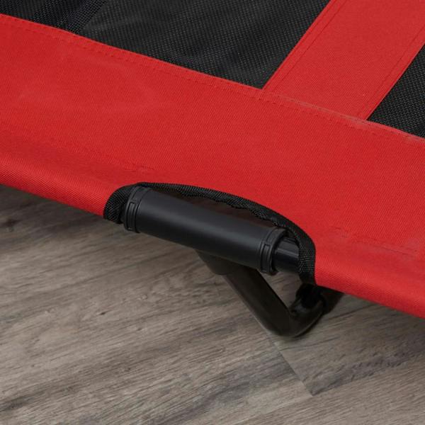 Close-up of red elevated dog cot leg with black reinforced edge and straps