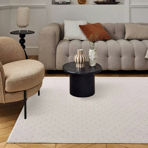 Living Room rug, grey-cream colours, dots, practicality in mind, the rug is anti-allergic.