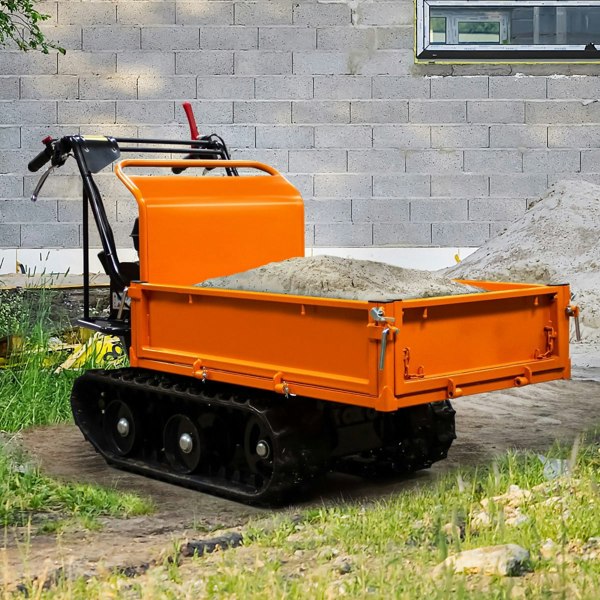 Tracked mini dumper petrol transporter with an orange metal body, rubber tracks, and a filled cargo bed, set on a gravel path