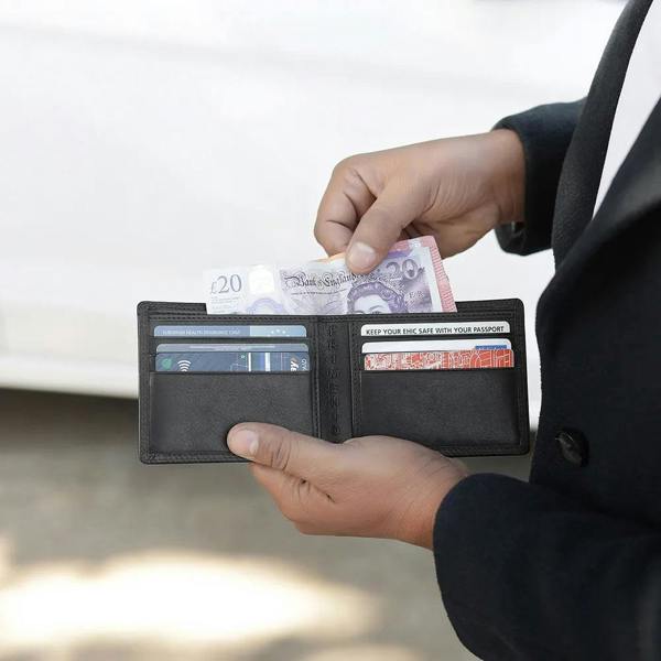 Interior of men’s black leather wallet with 6 card slots and slip pockets