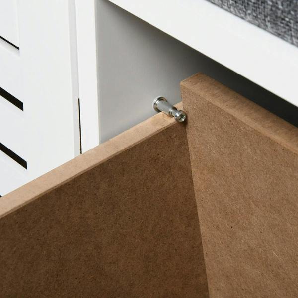 Open white shoe storage bench compartment with cork interior and metal latch