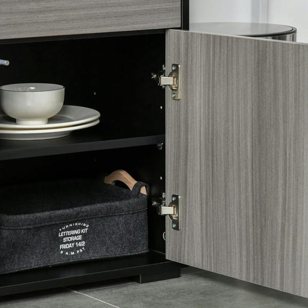 Open sideboard showing interior shelves and light gray door with metal hinges