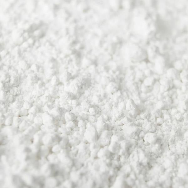 Close up image of the white powder of Texture Dust