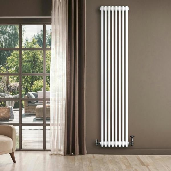 Traditional 4 column radiator in white, 1800 x 380mm, featuring a sleek vertical design, installed beside a large window with natural light