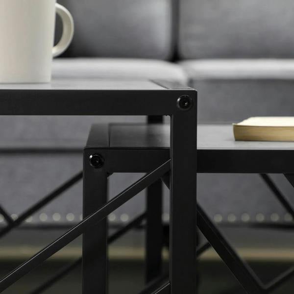 Close-up of black metal tabletop support with screws and cross-braced frame