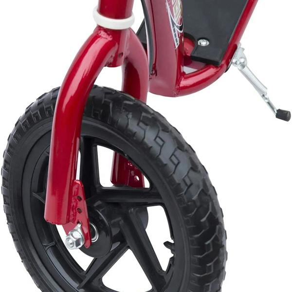 Red kick scooter close-up of front wheel with large black EVA tire and black wheel spokes
