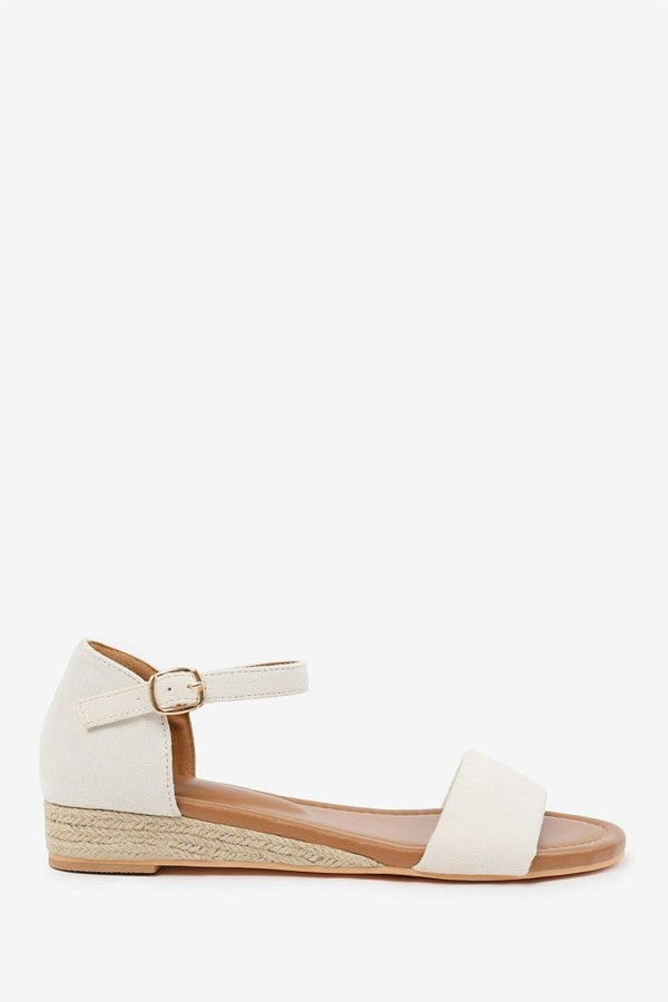 Where's That From Eleanor Wide Fit Low Wedge Shoes With Adjustable Ankle Strap in Cream Suede