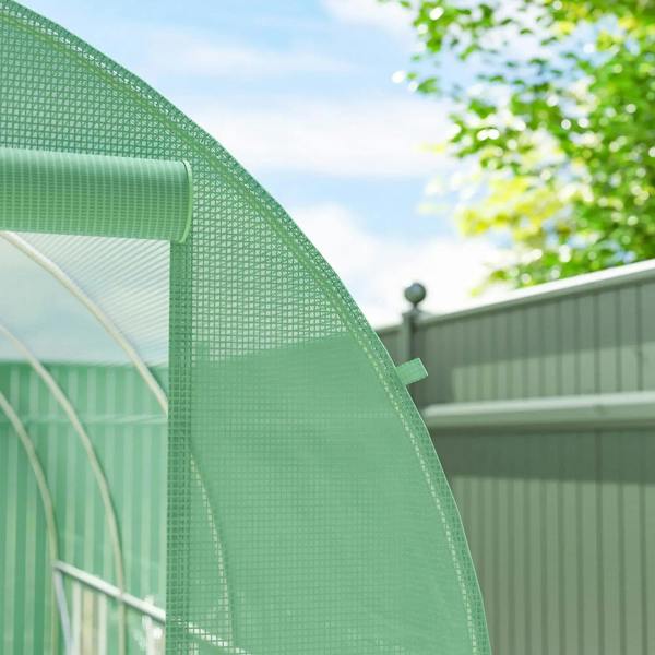 Green polytunnel greenhouse cover fabric and curved steel frame detail