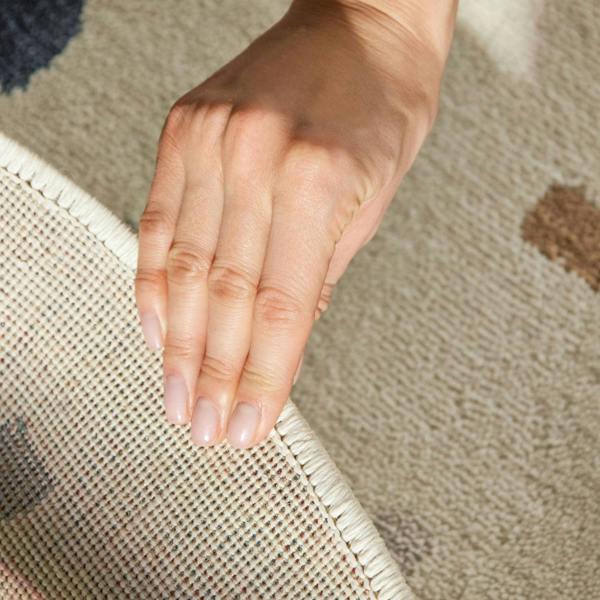 Close-up of a hand touching a textured surface