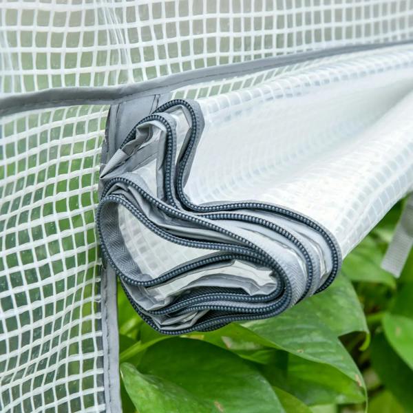 Close-up of rolled white greenhouse PE cover material with sewn edge and strap