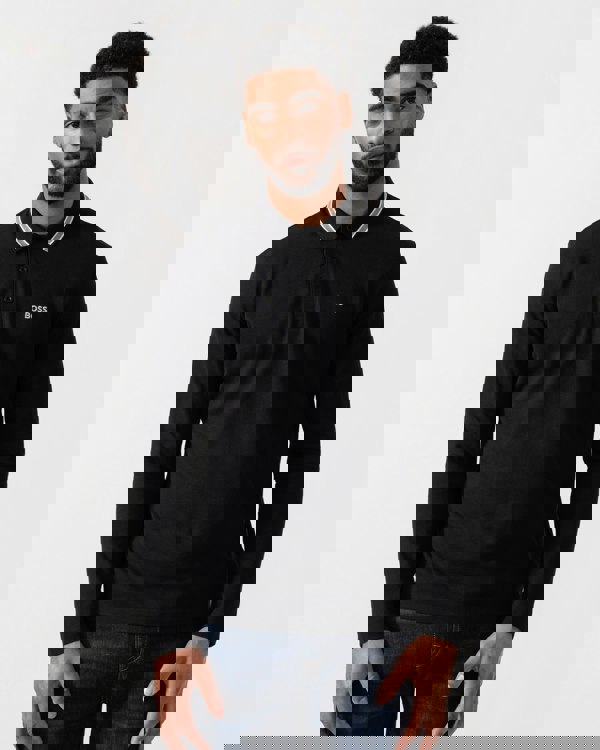 Model wearing BOSS Green Mens Plisy Long Sleeve Polo Shirt in Black 001 - Main