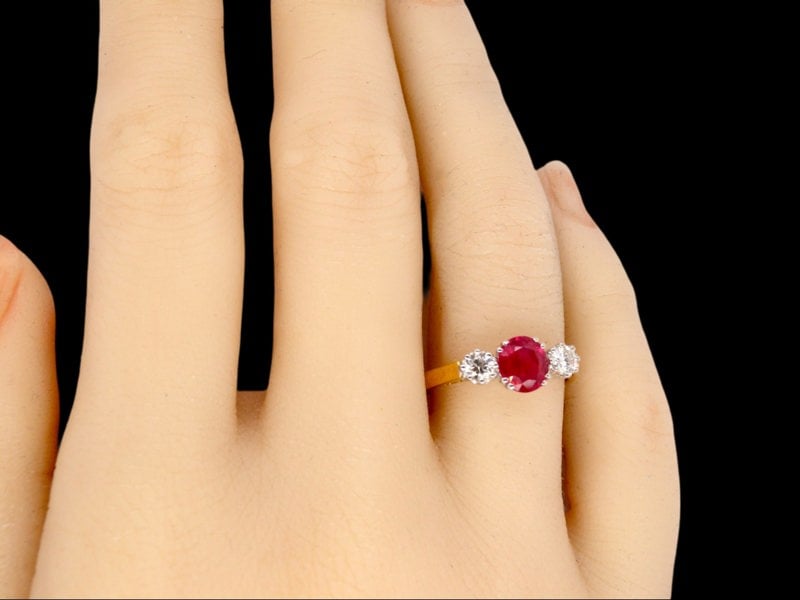 A Three Stone Ruby and Diamond Ring finger view