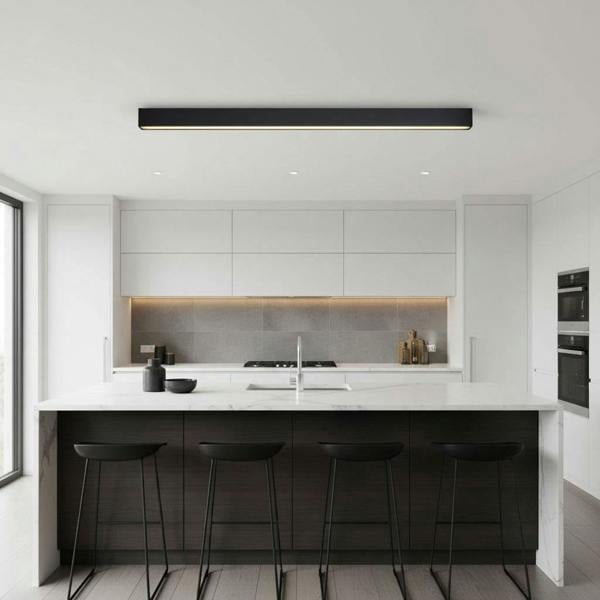 black surface mounted linear light mounted above a kitchen island 