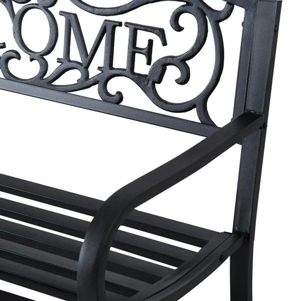 Black steel bench corner close-up with ornamental cutout and slatted seat