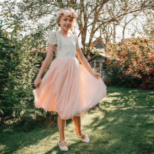 girl wearing bohemian flutter tea dress for uk flower girl boutique