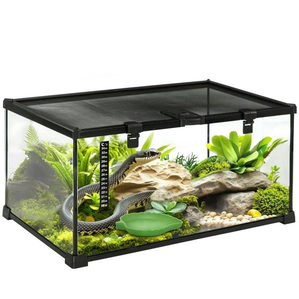 Black glass reptile terrarium with black frame, interior plants, rocks, and thermometer
