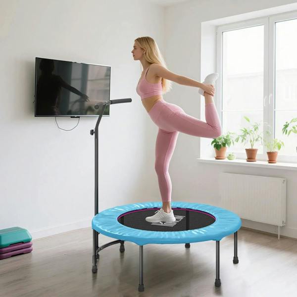 Blue mini trampoline with handle support and black center mat during leg lift