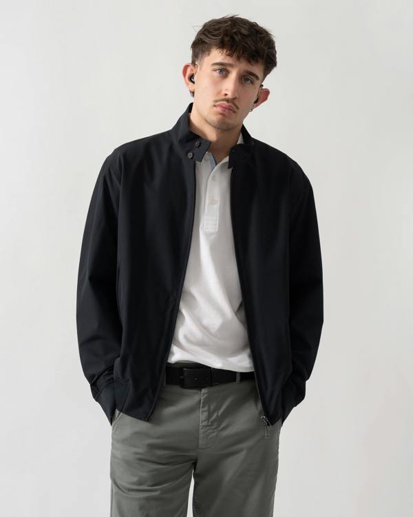 studio shot of a model wearing an Armani Exchange Mens Jacket XM002139-AF22536 in Deep Navy UB101