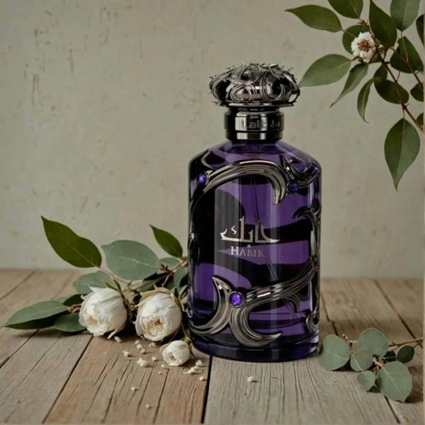 Lattafa Habik for Men Eau de Parfum 100ml bottle with flowers on table