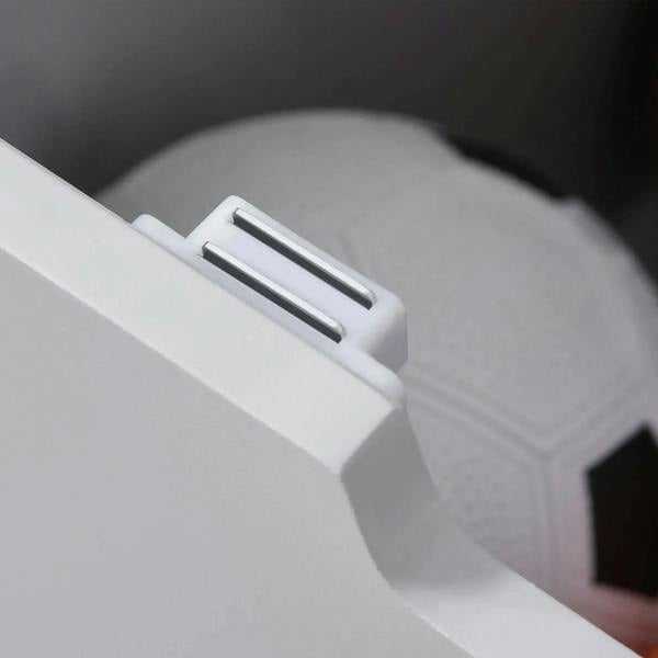 Close-up of grey toy box lid handle for lifting and closing the chest.