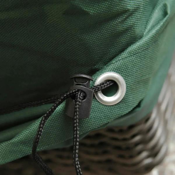Green patio furniture cover corner grommet with black cord tie loop and reinforced stitched edge.