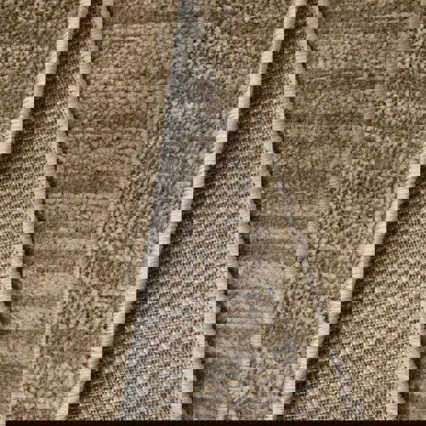 Close-up of the Arlo Textured Rug showcasing its soft pile and durable backing in a neutral brown tone.
