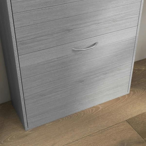 Close-up of grey wood-effect shoe cabinet drawer with curved metal handle