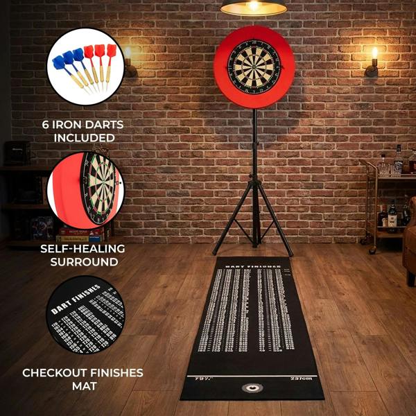 Dart board set featuring a vibrant red target, six iron darts, and a self-healing surround, displayed on a stylish mat in a cozy setting