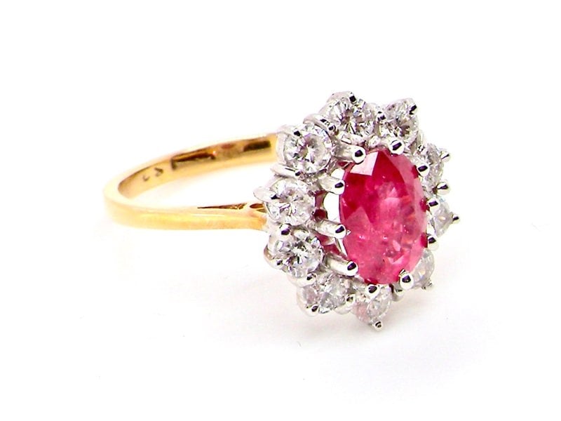 Vintage Tom A fine ruby and diamond cluster ring